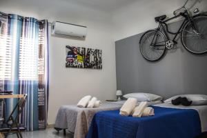 A bed or beds in a room at B&B Porta Nuova
