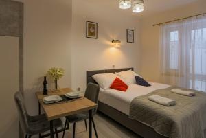 Postel nebo postele na pokoji v ubytování Apartamenty pokoje Jasna