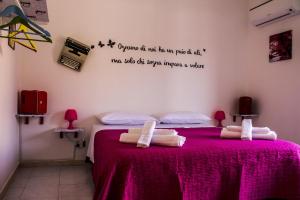 A bed or beds in a room at B&B Porta Nuova
