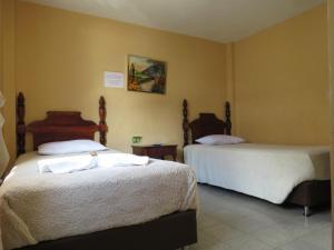Postel nebo postele na pokoji v ubytování Hotel Tahami + 20 fotografií