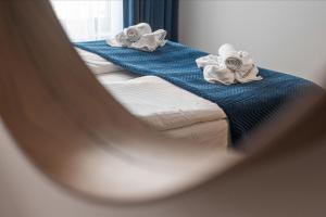 Posteľ alebo postele v izbe v ubytovaní Atena Premium - BillBerry Apartments