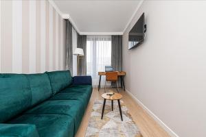 Televízia a/alebo spoločenská miestnosť v ubytovaní Atena Premium - BillBerry Apartments