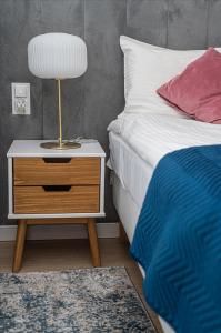 Posteľ alebo postele v izbe v ubytovaní Atena Premium - BillBerry Apartments