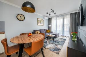 Televízia a/alebo spoločenská miestnosť v ubytovaní Atena Premium - BillBerry Apartments