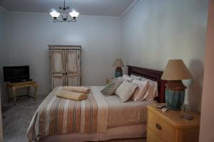 Postel nebo postele na pokoji v ubytování ENTRE VIÑAS