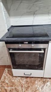 Kuchyň nebo kuchyňský kout v ubytování Piso Grande Amplio para grandes grupos 4 Dormitorios 2 baños,Asc 4AC y WIFI