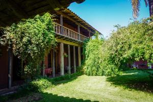 a house with two trees in front of it at ENTRE VIÑAS in Santa Cruz