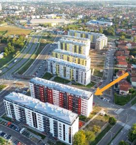 an overhead view of a building with a yellow arrow at MoonZE apartman, free parking in Novi Grad