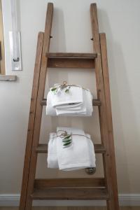 a towel ladder with towels on it in a bathroom at 12 living in Ancona