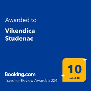 a yellow sign with the words awarded to viktorica subitzerland at Vikendica Studenac in Zlatibor