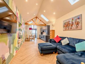 a living room with a couch and a table at 1 Bed in Lockerbie 93110 in Lockerbie