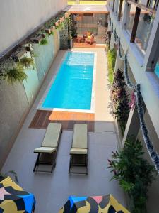 - une vue sur la piscine située dans un bâtiment dans l'établissement Terra Bella Pousada, à Morro de São Paulo