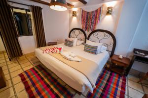 Postel nebo postele na pokoji v ubytování Vilas Insight Hotel Machupicchu