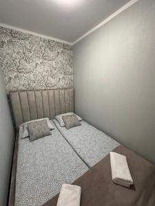 Posteľ alebo postele v izbe v ubytovaní Studio z sypialnią na Zatorzu
