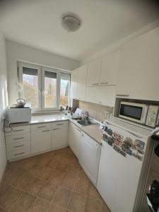 A kitchen or kitchenette at Mina sweet home apartment
