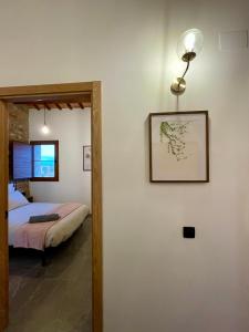 Giường trong phòng chung tại Mas de Melonet Delta del Ebro