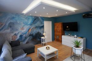 a living room with a large painting on the wall at Szent István koronája in Esztergom