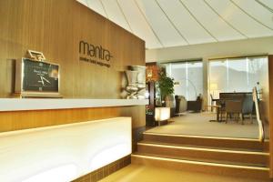 a restaurant with stairs leading to a dining room at Mantra Pavilion Hotel Wagga in Wagga Wagga