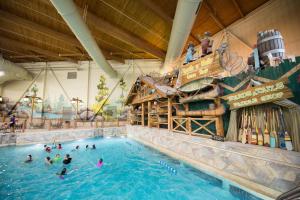 a group of people in a pool at a water park at Great Wolf Lodge Williamsburg in Williamsburg