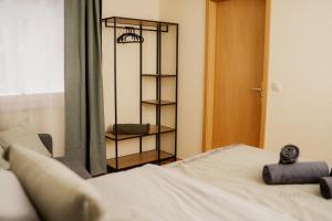 a bedroom with a bed and a book shelf at Lieblingsplatz by Julia & Tom in Kesselsdorf