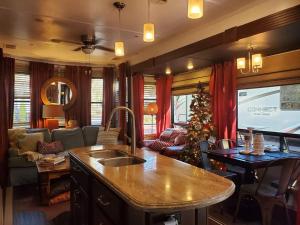 a kitchen and living room with a christmas tree at Jolene in Gatlinburg