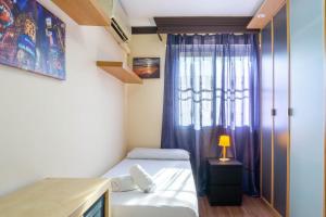 Posteľ alebo postele v izbe v ubytovaní Apartment Aconte Malaga
