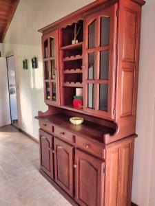 a wooden cabinet in a room at Magnolia azul in Federación