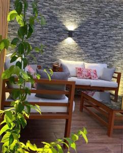 Posezení v ubytování شاليهات روشانا