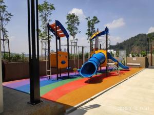 a playground with a slide in a park at Nadayu Studio 舒适环境民宿大阳台适合举办生日会 in Kuala Lumpur