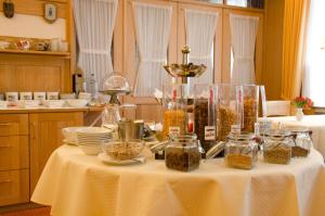 a table with jars of food on it in a kitchen at Hotel Wieting in Oldenburg