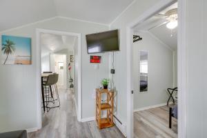 a living room with white walls and a flat screen tv at Wildwood Apartment, Walk to Crest Pier and Beach! in Wildwood