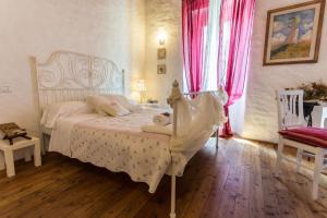 A bed or beds in a room at Antiche Mura