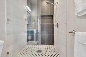 a bathroom with a shower with a glass door at Stylish guest house near colleges in Claremont +21 photos