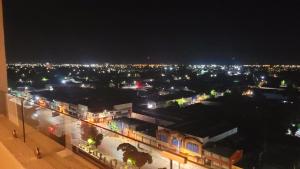a view of a city at night with lights at dpto x día chillan 1411 in Chillán +1 photo
