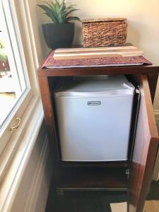 a small table with a small refrigerator under a table at Pacific Heights Chic Jr Studio in San Francisco