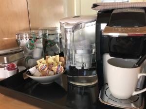 a coffee maker with a bowl of food and a cup of coffee at Pacific Heights Chic Jr Studio in San Francisco