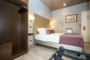 Postel nebo postele na pokoji v ubytování Vaticano Julia Guest House