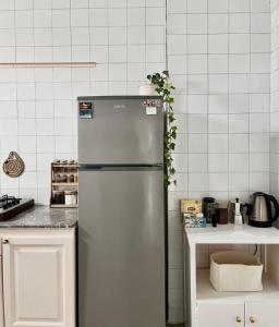 a stainless steel refrigerator in a kitchen at Flat In Tetouan City Centre Medina - NEW Dar Azhar in Tétouan