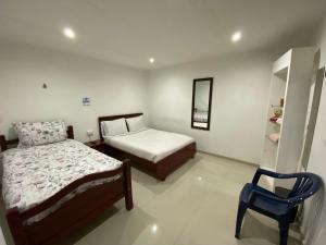 Postel nebo postele na pokoji v ubytování Stay In Bogota