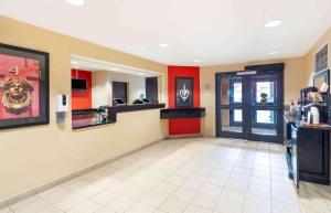 a restaurant lobby with red and yellow walls at Extended Stay America Suites - Fairfield - Napa Valley in Fairfield