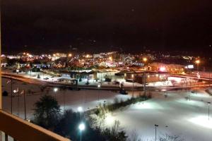 a view of a city at night with lights at Vista Suites Pigeon Forge - SureStay Collection by BW in Pigeon Forge