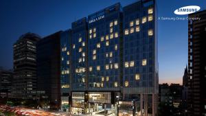 a large building with many windows at night at Shilla Stay Yeoksam in Seoul