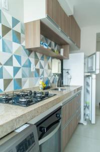 A kitchen or kitchenette at Apartamento privativo Pindamonhangaba-SP