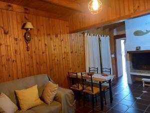 a living room with a couch and a table at Maneki in La Paloma