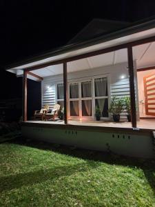 a screened porch of a house at night at Luxury private guest suite in the Blue Mountains in Springwood