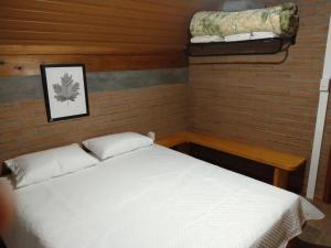 Giường trong phòng chung tại Refúgio Verde
