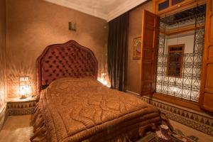 a bedroom with a large bed in a room at Riad Scalia Traditional Guesthouse Fes Morocco in Fès