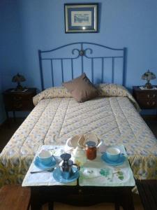 A bed or beds in a room at Hospedaje - Ferrería Quintá
