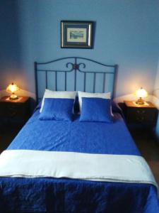 A bed or beds in a room at Hospedaje - Ferrería Quintá