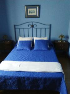 A bed or beds in a room at Hospedaje - Ferrería Quintá